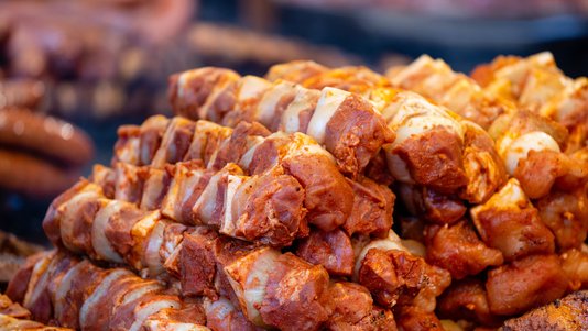 marinated raw pork pieces prepared for barbecue