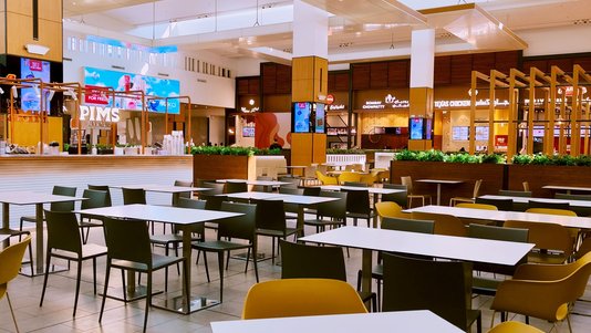 modern food court with multiple counters and dining area